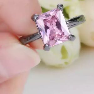 Pink sapphire princess halo solitaire ring